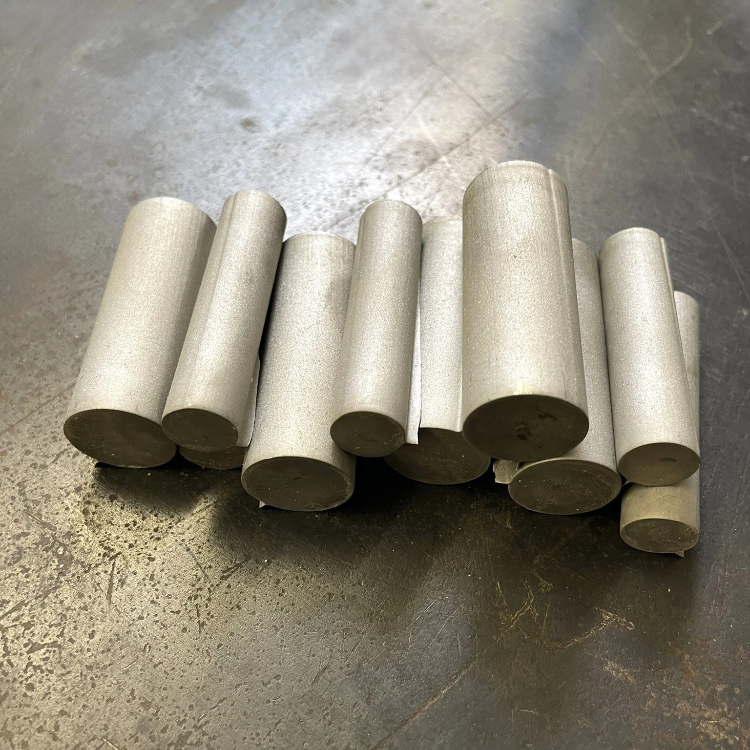 AA WATERJET_ STAINLESS PLUGS CUT FROM 2 INCH THICK MATERIAL